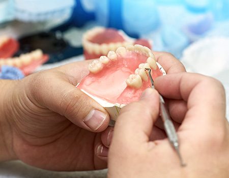 Dentures can be made of a variety of materials including acrylic and nylon