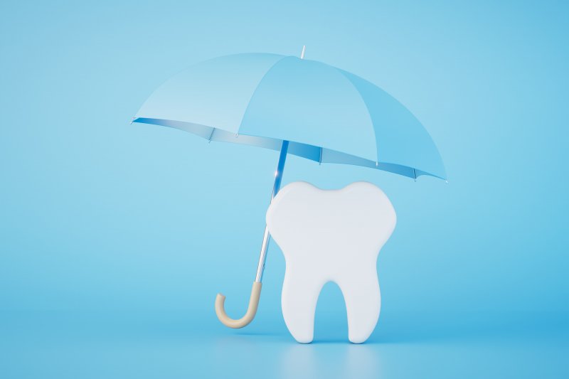 a tooth being covered by an umbrella
